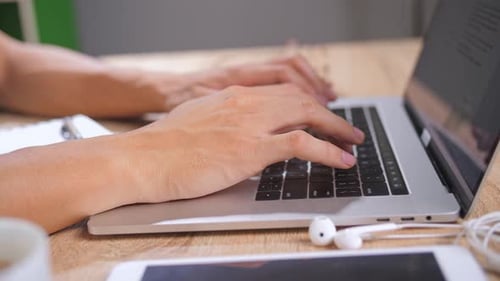Hands Typing On Keyboard