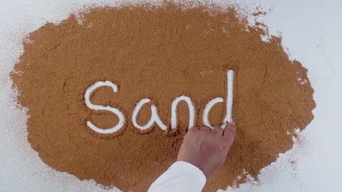 Writing Word Sand in Brown Powder