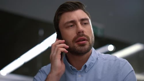 Man Answers Phone Call and Starts Smiling