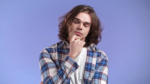 Young Man Posing with Contemplative Expression