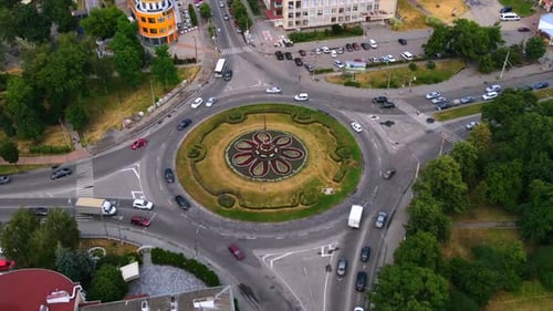 Aerial View Timelapse of Roundabout Road with Circular Cars in Small European City