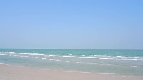 Beautiful tropical beach sea ocean with blue sky and white cloud