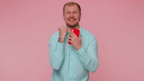 Happy Excited Man Use Mobile Phone Say Wow Yes Found Out Great Big Win News Doing Winner Gesture