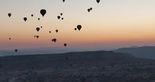 Aerial Cinematic Drone View of Colorful Hot Air Balloon Flying Over Cappadocia