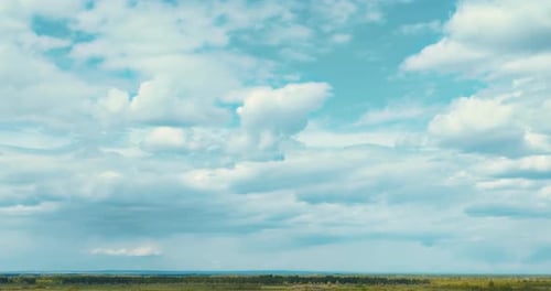 Beautiful Aerial Panoramic View From Cloudy Sky to Sown Wheat Field View From Drone Prores