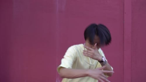 Young Man Dancing Hip Hop in the Street