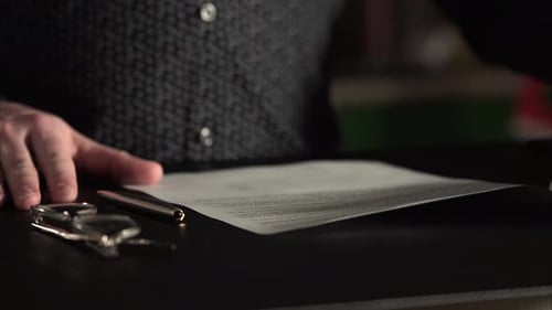 Close Up Shot of a Businessman Hands Who Looks Documents and Leave the Signature