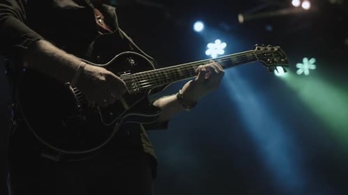 Silhouette of Guitar Player on Stage