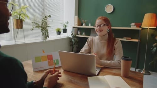 Colleagues Working Together in Modern Office