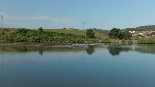 Mountain lake with turquoise water and green trees. Reflection in the water. Beautiful spring landsc