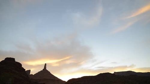 The sun rises over a desert landscape in Utah, USA