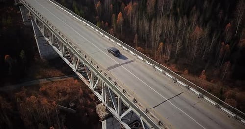 Drone Flying Above Cars Passing Over the Bridge.
