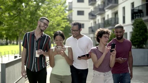 Happy Friends with Smartphones Walking on Street