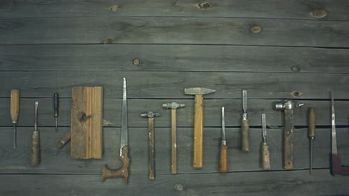 Collection of Vintage Carpentry Tools on a Wooden Surface