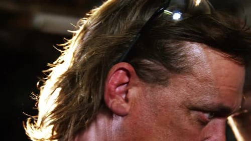 Man Adjusting Safety Glasses Wearing Gloves