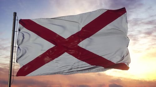 Waving Alabama Flag Against a Dramatic Sunset Sky