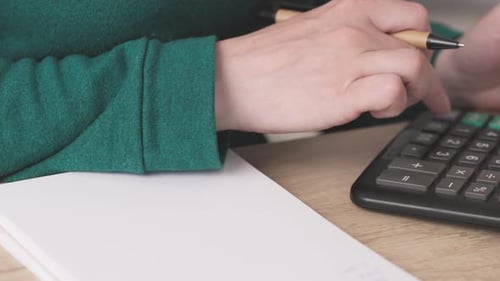 Closeup Female Hands Fingers Counting on Calculator Writing Numbers Summary