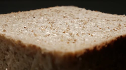 Complete meal bread made of full grain close-up surface 4K 2160p 30fps UltraHD tilting footage - T
