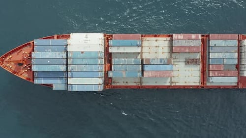 Aerial View of a Cargo Ship Transporting Containers with Various Goods