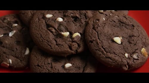 Delicious Chocolate Cookies with White Chocolate Chips on Plate