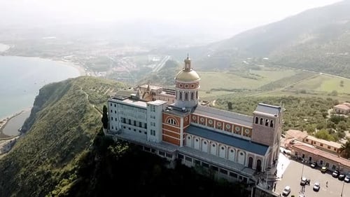 Drone flight over the sanctuary of Tindari, Sicily, Italy with the mediterranean Sea in the backgrou