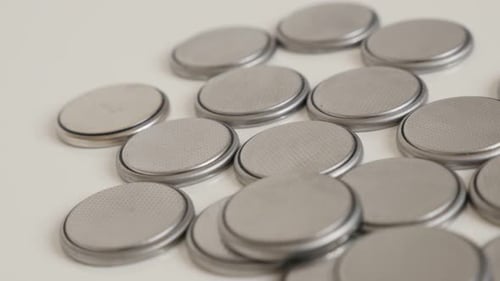 Pile of Silver Button Batteries Close Up