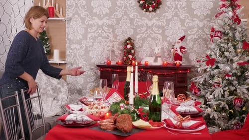 Family Gathers at Christmas Dinner Table