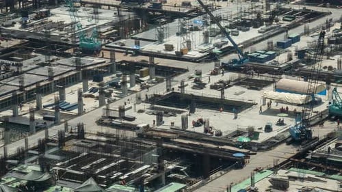 Time lapse of construction site with heavy construction machinery in metropolis
