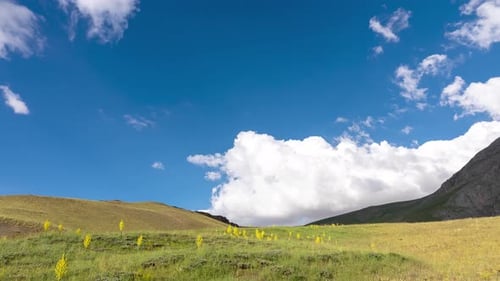 Clouds Drift Over Green Mountain Grassland Timelapse