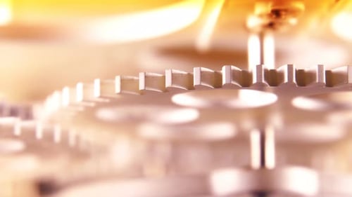 Close Up of Gold Metal Gears Turning