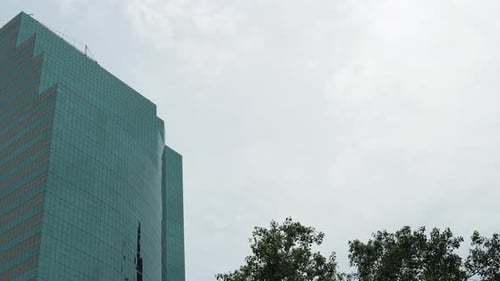Close-up view of skyscraper of glass and steel with mirror surface