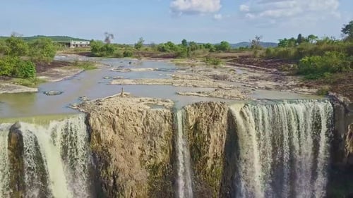 Scenic Waterfall and Lush Green Landscape Aerial