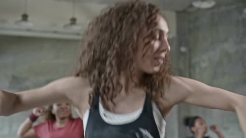 Energetic Women Dancing in a Fitness Class
