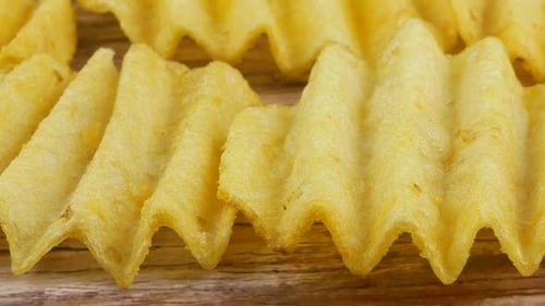 Ribbed potatoes snack chips close up