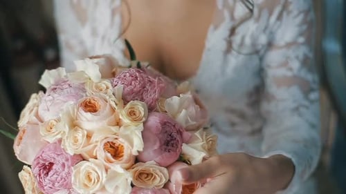 Bride Holds Wedding Bouquet Close Up