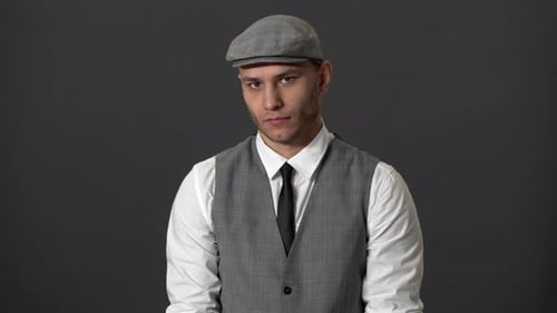Stylish Young Adult Man in Vest and Cap