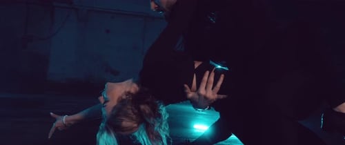 Dancers Performing Together in Dark Urban Space