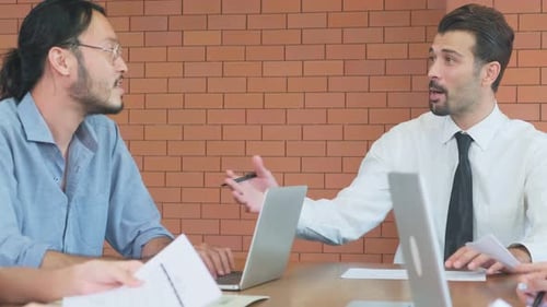 Asian young business people group having a discussion meeting brainstorming and working in office.