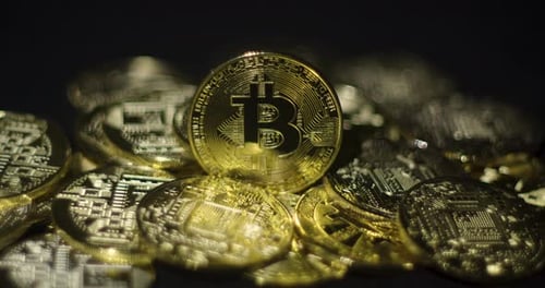 Pile of Shiny Golden Bitcoin Cryptocurrency Tokens