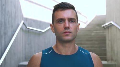 Athletic Man Posing Near Urban Staircase