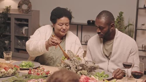 Happy Family Shares Christmas Dinner at Home