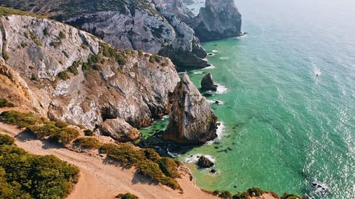 Aerial View of Rocky Cliff Coastline Near Praia Da Ursa Beach and Cabo Da Roca Located on Atlantic