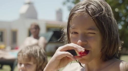 Child Eating Watermelon on Sunny Summer Day