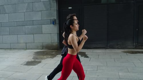 Sporty Couple Jogging at Morning Run. Fitness Man and Woman Running Together.