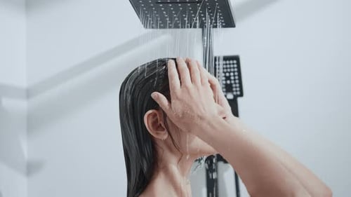 Woman Enjoying Refreshing Shower Cleansing Hair