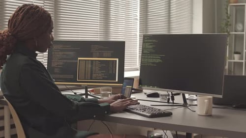 African American Female Programmer Writing Program Code