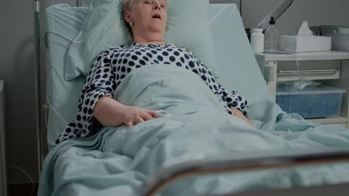 Doctor and Nurse Assisting Patient With Oxygen Mask