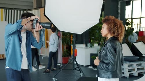 Photographer and Model Working in Studio Shooting for Glamour Magazine