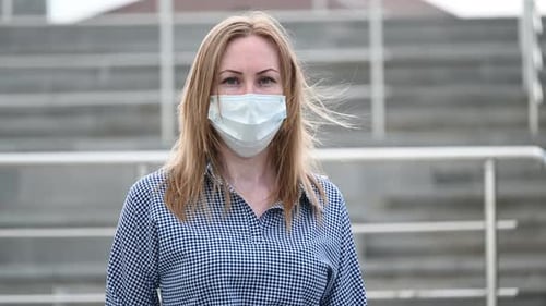 Woman wearing Face Mask in City Environment