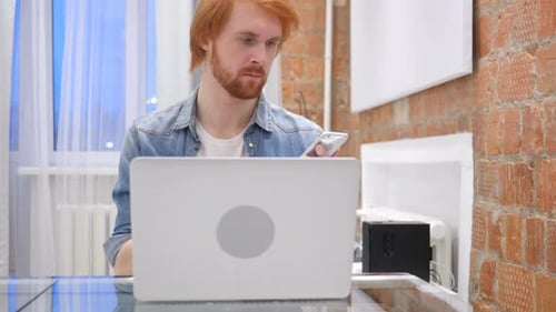 Man Browsing Online on Smartphone